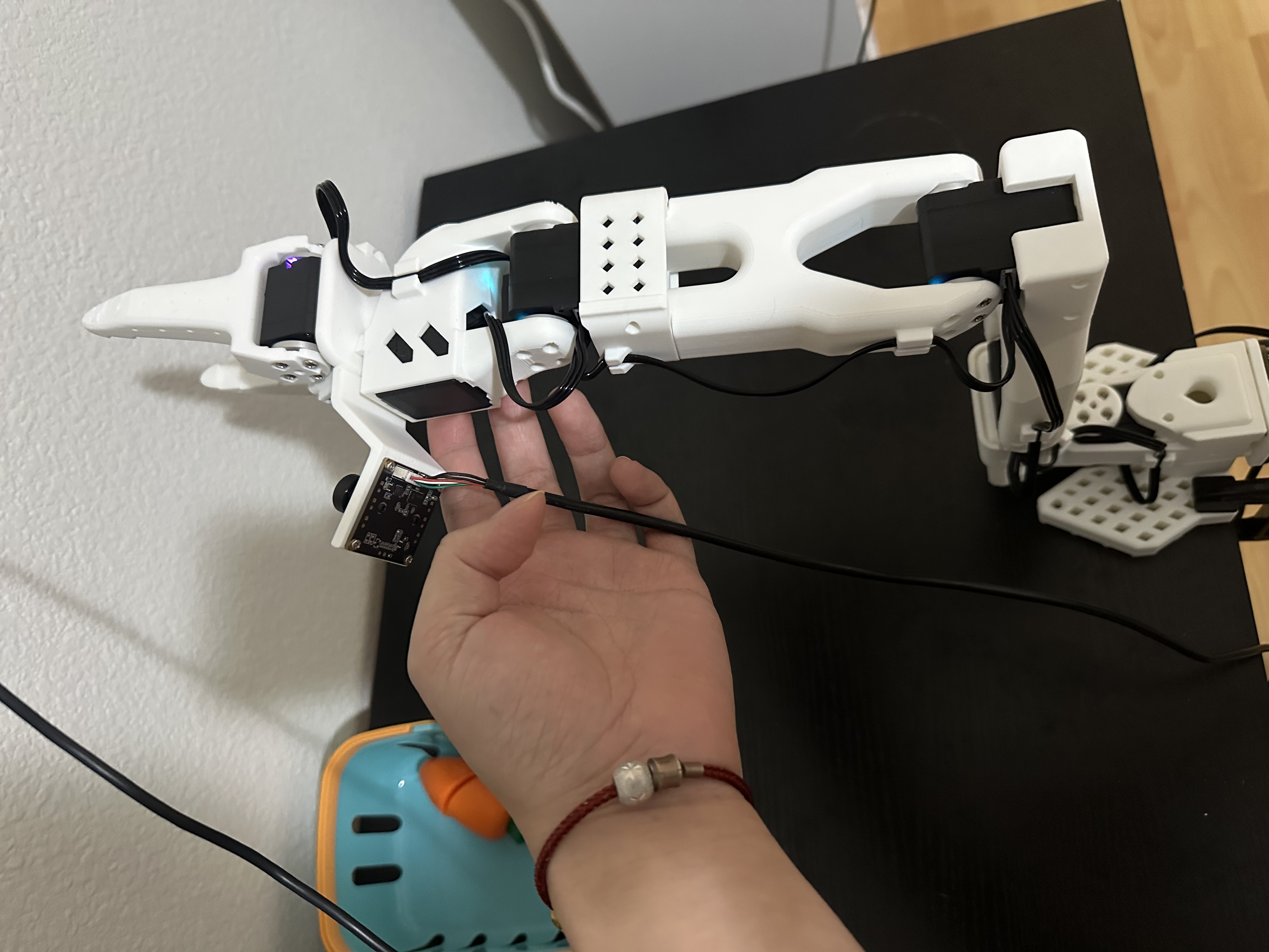 SO-101 arm during calibration, with the servos aligned around their middle positions.