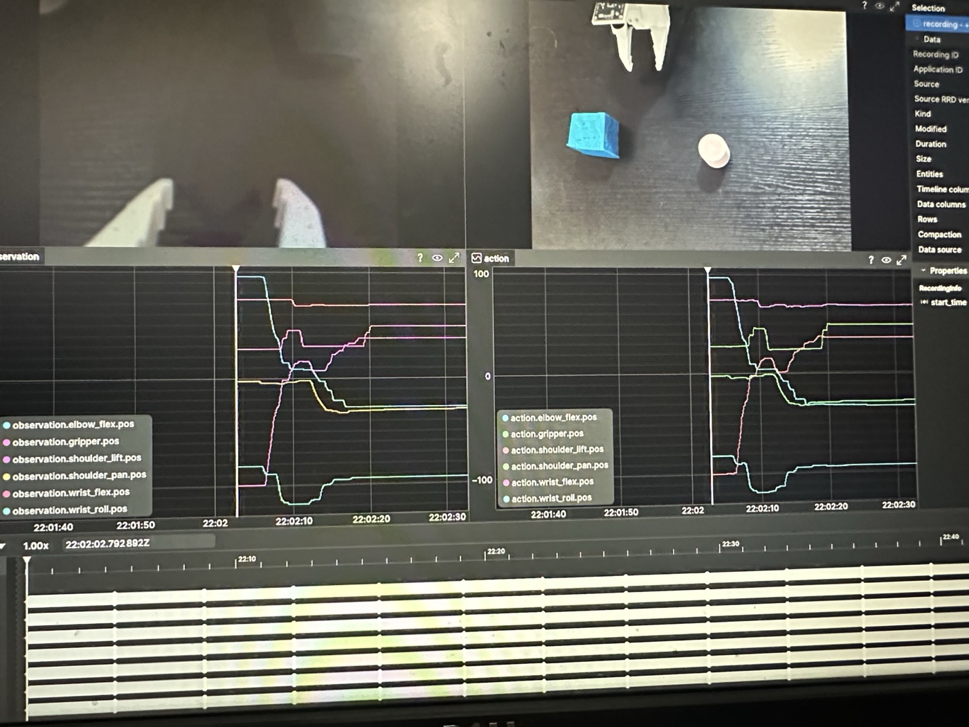 Rerun data-collection view for the cylinder-covering task, showing camera streams together with observation and action traces.