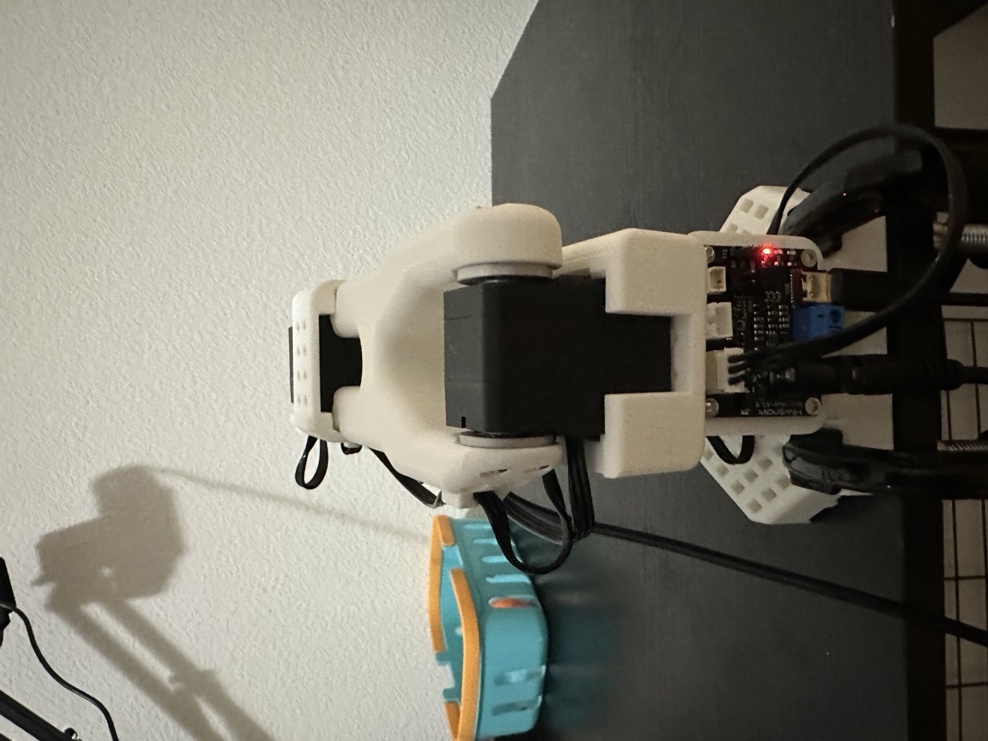 One assembled SO-101 arm mounted on the desk.
